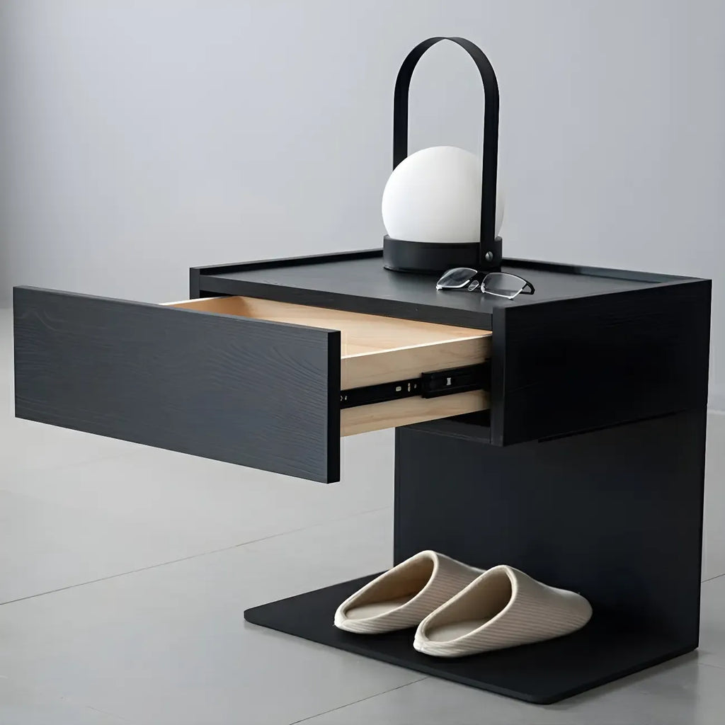 Table de chevet en forme de C avec tiroir et éclairage intégré, en acier noir et bois.