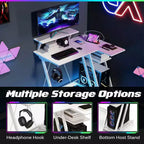 Bureau gaming en L Costway avec prises et ports USB, étagère pour écran et support de casque Noir/Blanc/Rose