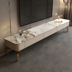 Meuble TV de luxe avec plateau en pierre blanche et pieds dorés, intégrant un espace de rangement