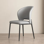 Chaise de salle à manger moderne en similicuir à dossier bas incurvé